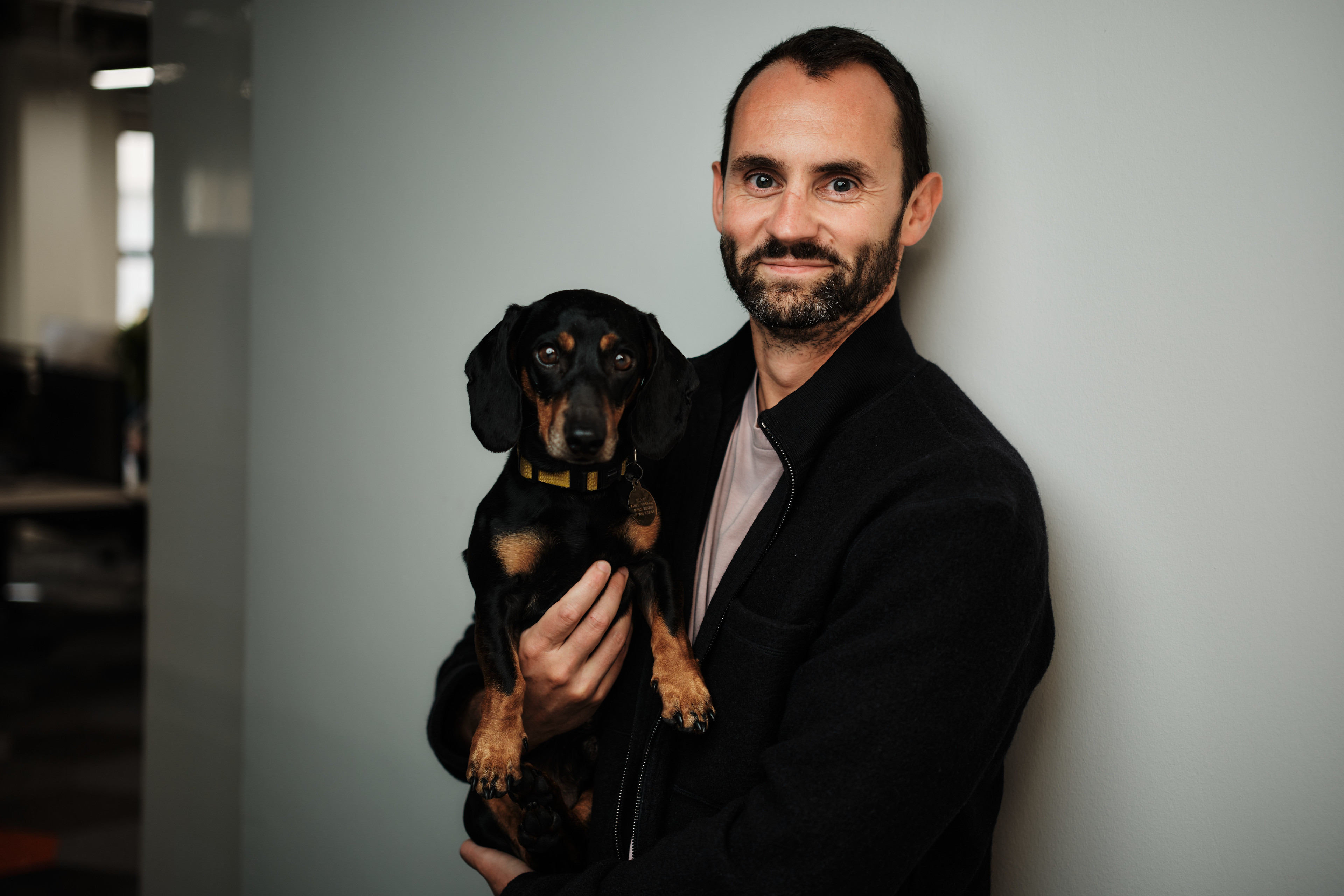 Dave Edwards holding his dachshund
